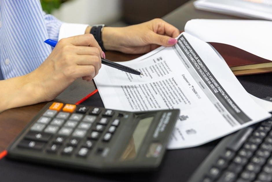 Small business owner analyzing cash flow reports on laptop